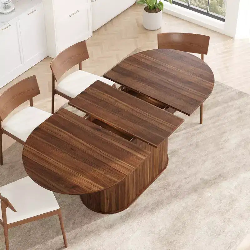 Table à manger ovale extensible noire / naturelle / noyer, piètement central, jusqu'à 6 places
