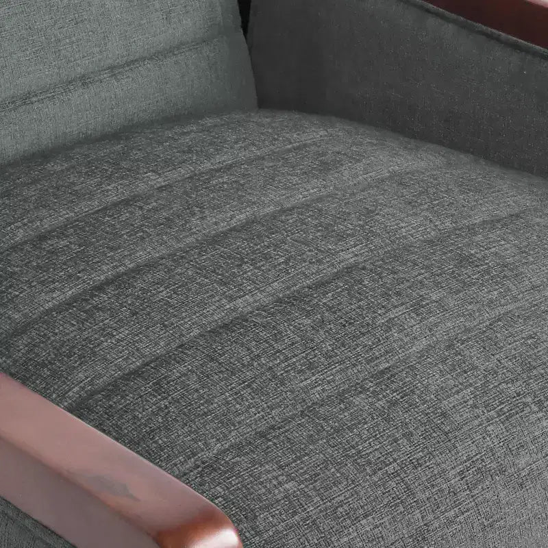 Fauteuil inclinable gris une place avec surpiqûres sur le dossier et les accoudoirs